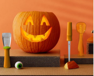 a knife, and a pumpkin showing pumpkin drawing tools